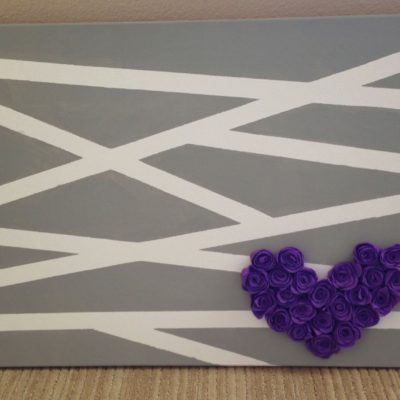 Felt flower heart on a painted canvas